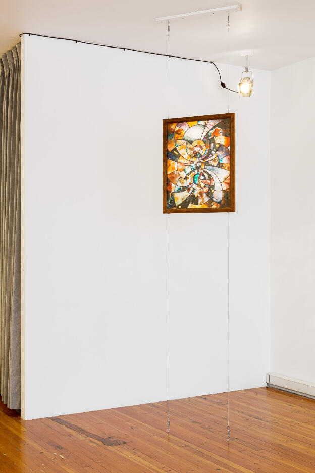 The Light of Their Eyes (bipolar coordinates), 2016, UV print on cathedral glass, cherry & plywood frame, theatrical Fresnel, dimensions variable